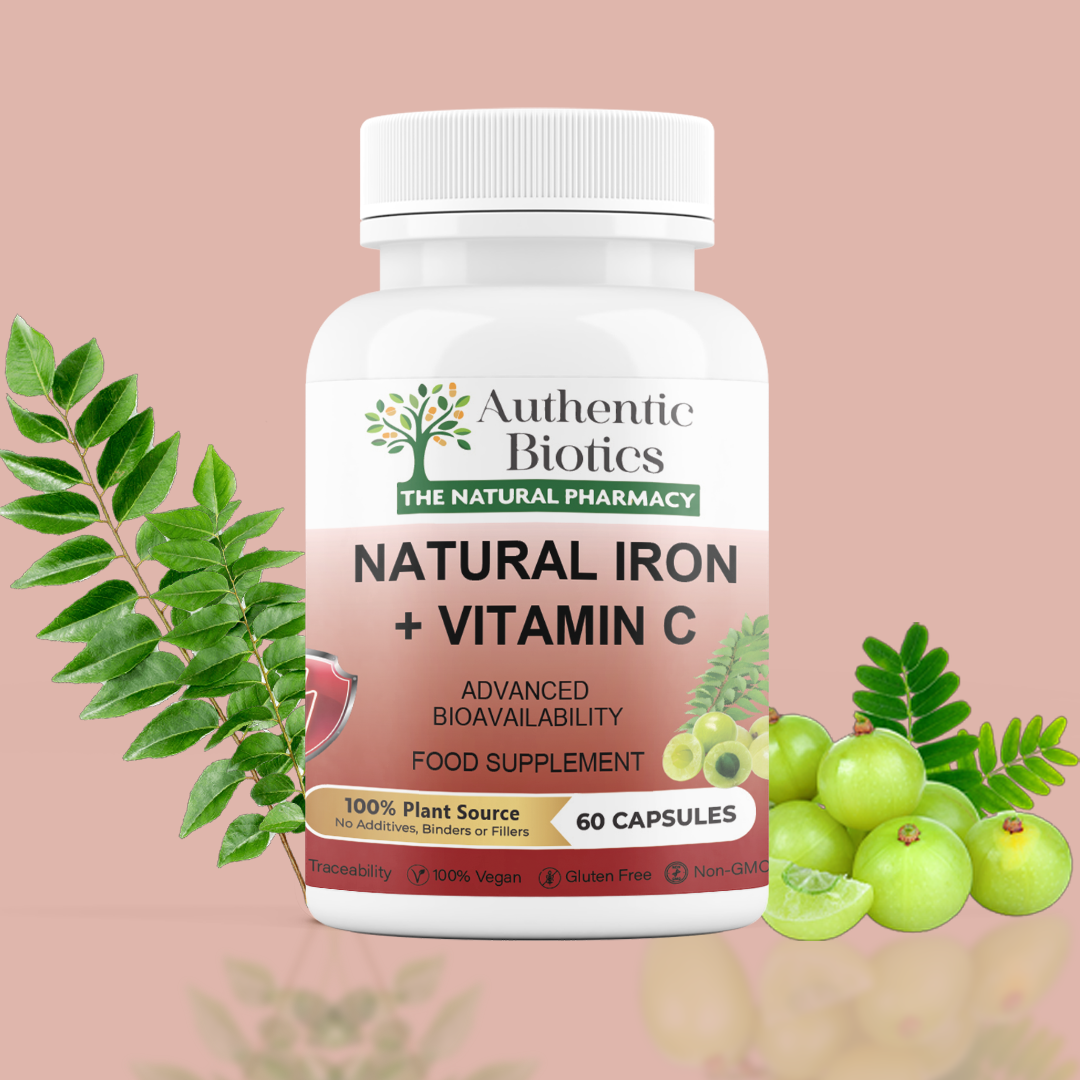 A bottle of Authentic Biotics Natural Iron + Vitamin C with a label showing a tree and leaves, indicating it's a plant-based supplement. There are 60 capsules mentioned, and it's labeled as vegan and gluten-free.